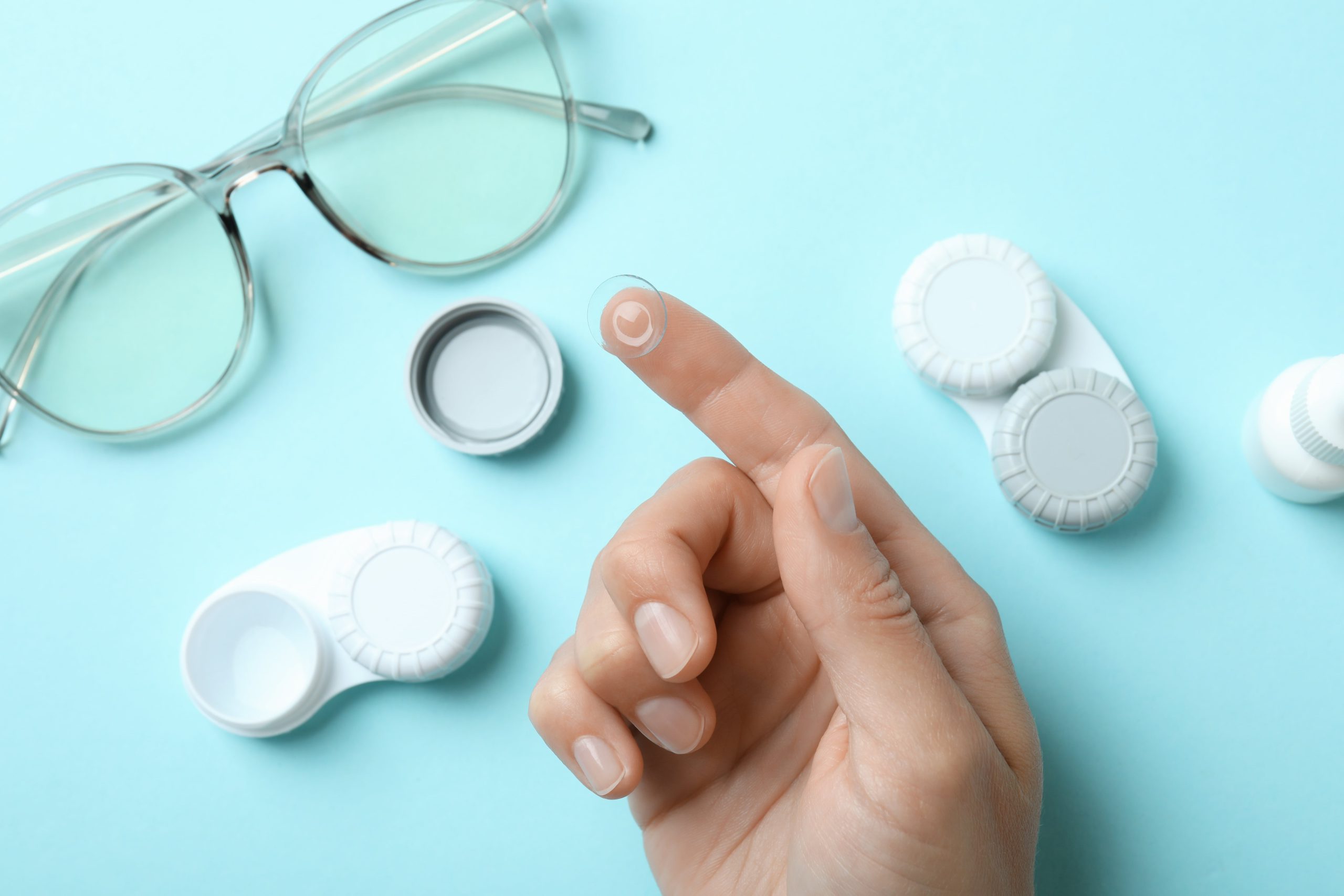 Contact lenses held on fingertip, moments before application