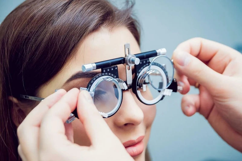 A woman in eye testing room at The Optical Technology Centre in Limassol.
