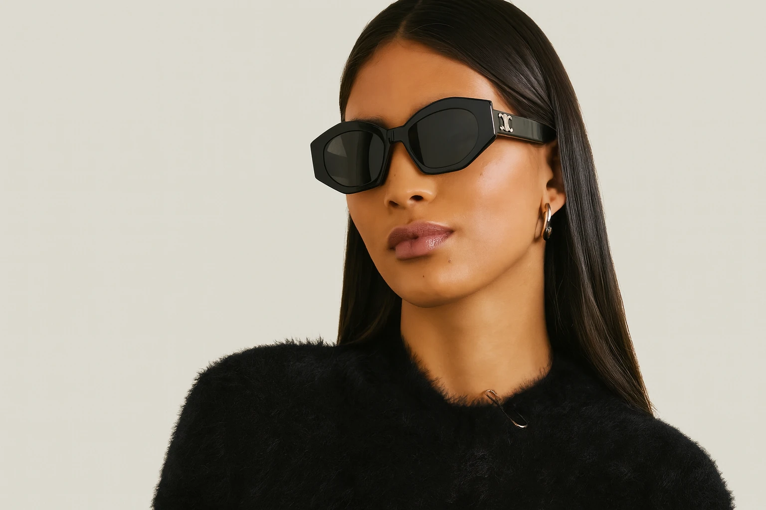 Woman wearing black designer sunglasses